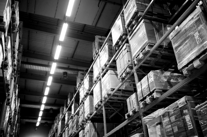 brown cardboard boxes on white metal rack
